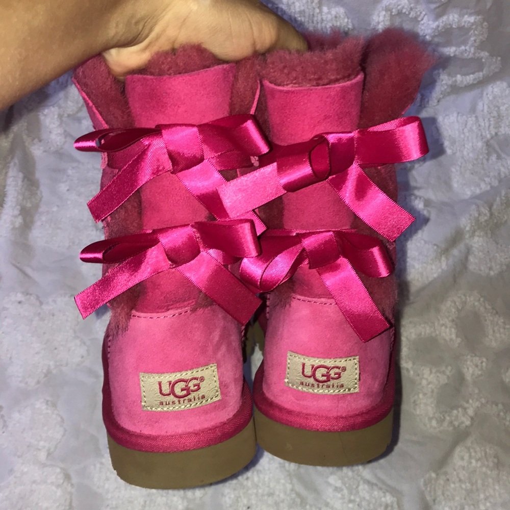Pink UGG boots with bows